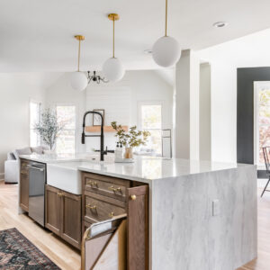 Mexican - style kitchen cabinet design in a completed apartment project by a Mexico Cabinet Manufacturer, featuring modern lighting and sleek countertops