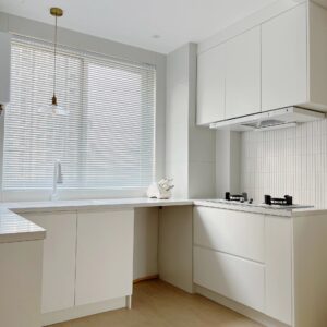 Bright and minimalist kitchen in a UAE apartment, highlighting YIDA Home's custom cabinet design