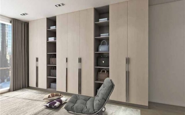 Traditional cabinets with classic hinged - door design and wooden tones.